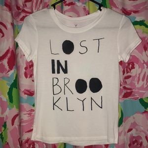 White tee, xs American Eagle, “Lost in Brooklyn”.